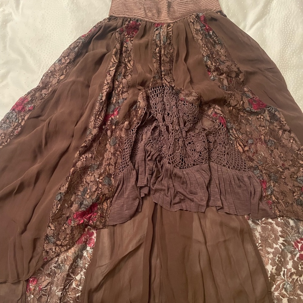 Free people shirt see through shorter on the front longer in the back